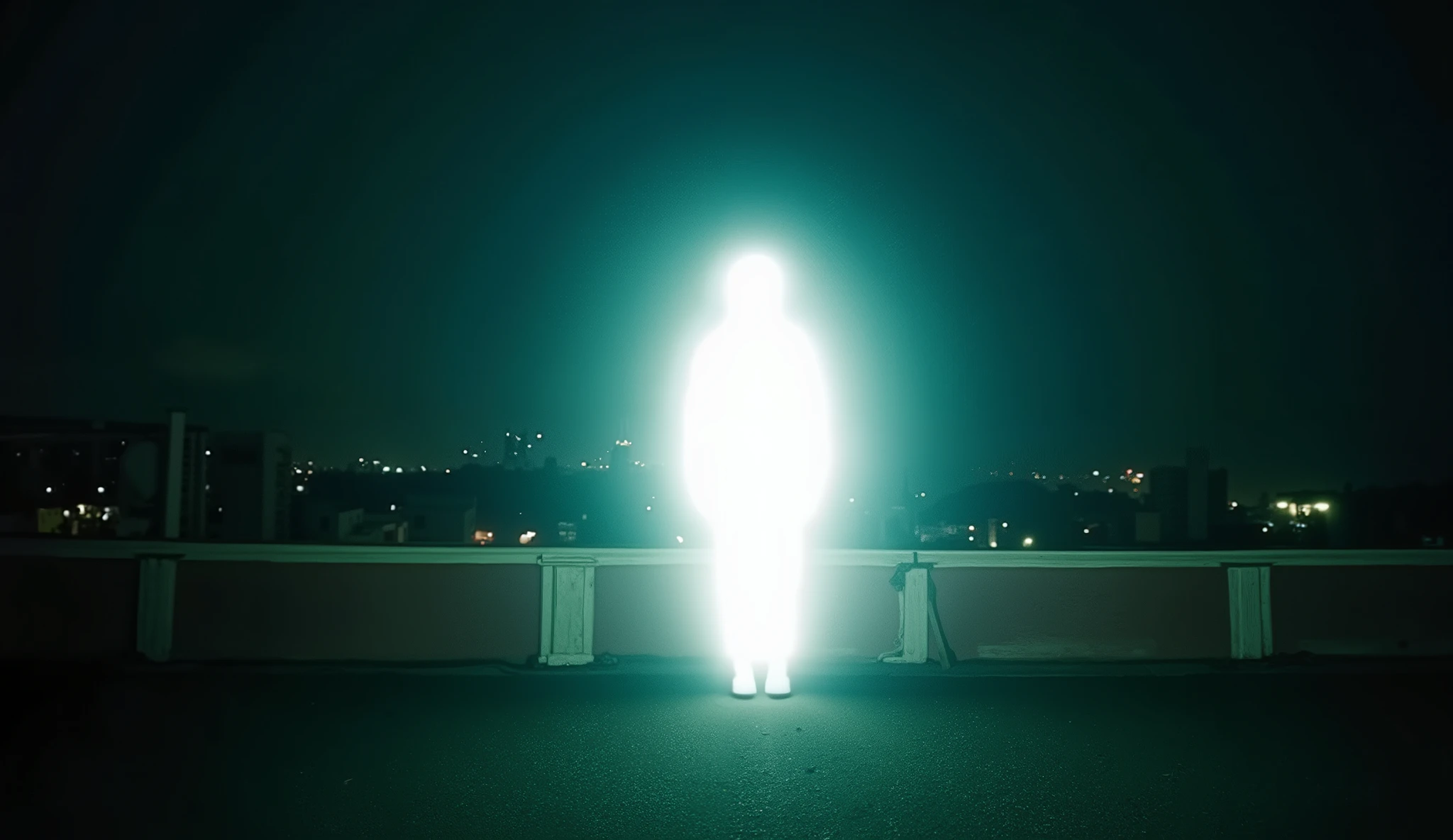 Photorealistic, epic cinematic quality. Shot on an ARRI Alexa with vintage Cooke S4 anamorphic lenses for creamy bokeh and wide dynamic range. Nighttime rooftop setting with cool twilight tones and warm distant city lights. Desaturated teal shadows and subtle warm highlights, fine film grain throughout.
A lone human figure stands at the center, but their entire body is an overexposed white silhouette—glowing softly like a blown-out light source. No facial features, no details, just a bright human-shaped form emitting a subtle halo. The surrounding rooftop, railing, and skyline remain properly exposed, emphasizing the surreal contrast.
Dreamy city bokeh, atmospheric haze, and gentle rimlight react to the glowing silhouette. Mood is emotional, melancholic, and ethereal—perfect for a Pop R&B or Illenium-style cover.