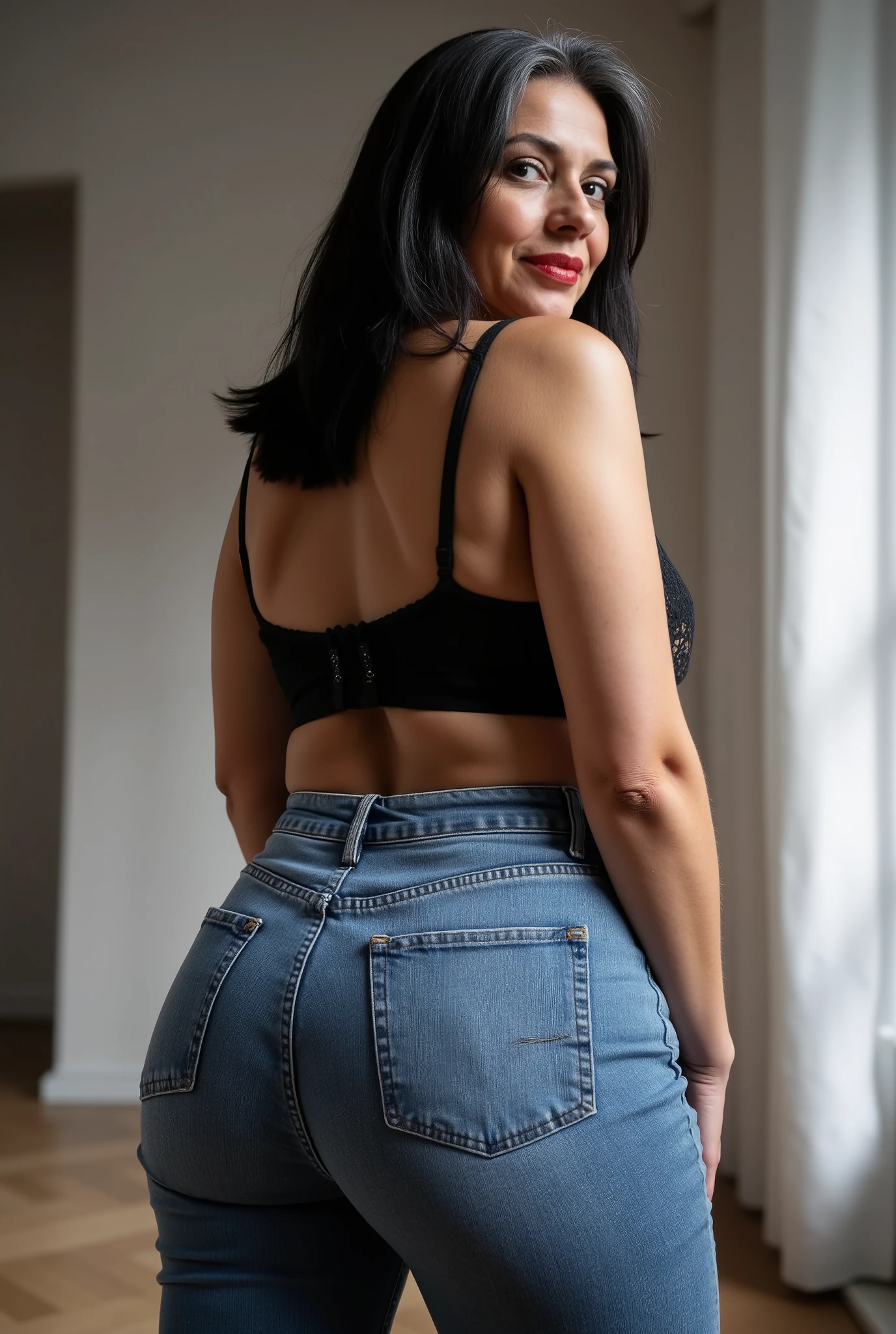 Lowangle,A european, mature woman, 60 years old, stands in jeans, her back to the camera, positioned on the floor directly behind her for a steep straight rear view. The composition is close, visually focusing on the curves of her hips and buttocks, while she glances down over her shoulder to make eye contact with the lens. Condescending expression, crow's feet, glossy red lipstick, looking down on viewer, mom vibes, realistic mature body proportions. Straight shoulder length hair dyed black with grey roots, wearing lace bra. Soft indoor lighting highlights the denim texture and her smooth silhouette, with a blurred minimalist background for emphasis. Cinematic, intimate, stylish feel.