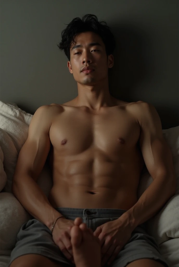 A young smiling Thai muscular ????? man lying on the bed , ?????????????????? widely opened , big bugle, 