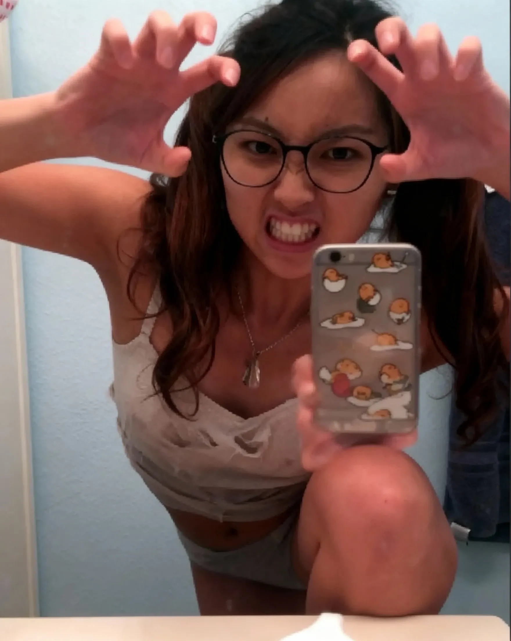 Absurd resolution, high resolution, (masterpiece: 1.4), hyper-detail,, (mirror selfie) a cute Asian babe, bright red hair, squats in ((black T-shirt, ?????)), fertile body, sneakers, ponytail, smiling, indoor, sweaty, drenched, , POV, open mouth