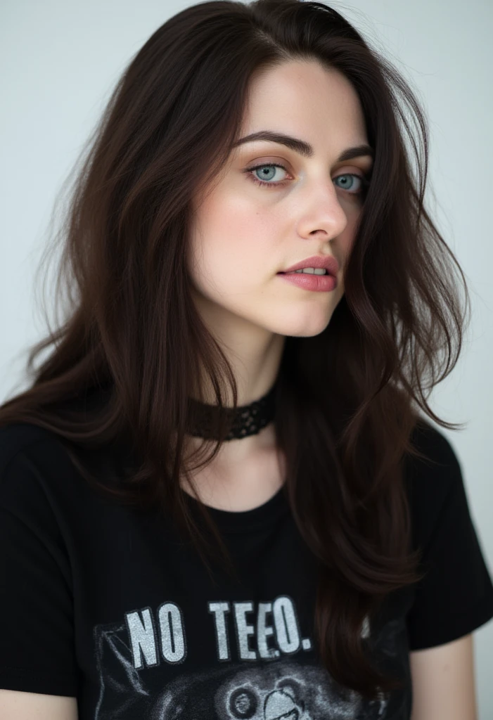 A young woman (20 years old) with a traditional goth style that includes a thick layer of white foundation, very big eyeliner, a bridge piercing and snake bites piercings. Her hair is black and she have blue eyes