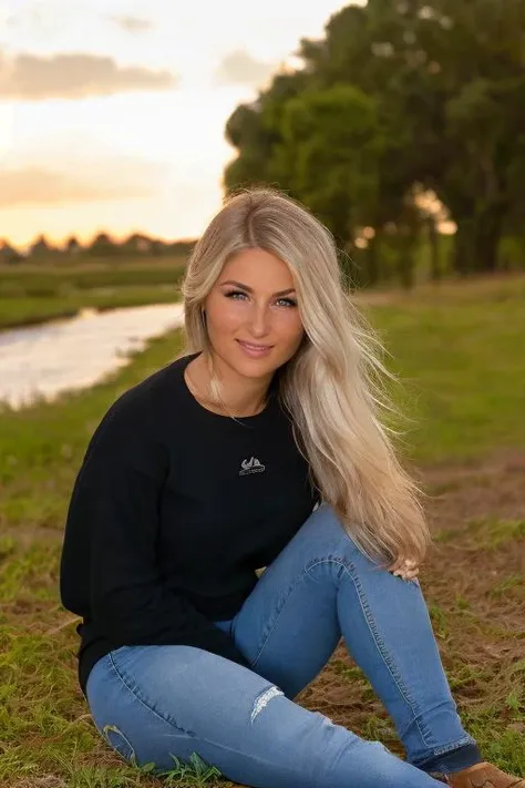 ((Wearing a sweater)) and ((very distressed jeans)), ((Professional Photo Shoot)), ((in the country next to a river)), ((Sitting on the grass with legs crossed)), smiling, model shoot style, extremely intricate, High Detail, Sharp focus, dramatic, soft cinematic light, (looking at viewer), (Real Eyes), (Detailed Eye Corneas) (detailed pupils), smiling, 24mm, photo lab, elegant, insane details, hyperdetailed, low contrast, epiCRealism, (((SFW)))   <lora:Carriejune_Anne_Bowlby:0.85> carriejune