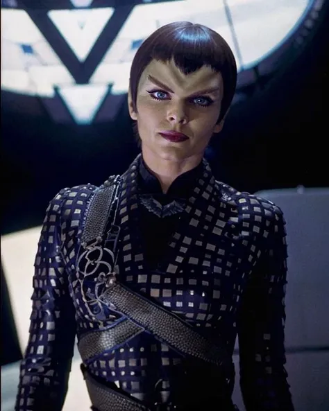 photograph, portrait, realism, <lora:donatra_lora:0.8>, donatra, woman, romulan, pointy ears, pointy eyebrows, v-shaped bangs, wearing romulan nemesis uniform, wearing lipstick, perfecteyes eyes, wide shot, 3/4 length, sci-fi space ship interior background, dina meyer, professional photography, award-winning, highly detailed, beautiful, <lyco:locon_perfecteyes_v1_from_v1_64_32:0.2>