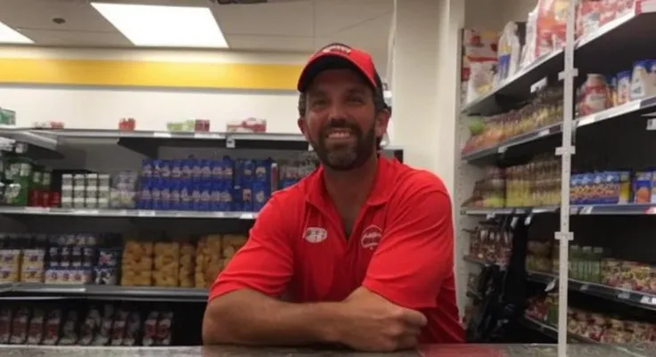 donaldtrumpjr person working behind the counter at a 7-1 1 convenience store. hes happy because he loves his new job (1man:1.5)