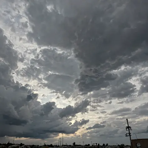The sky filled with various shades of gray clouds, covering most of the sky.