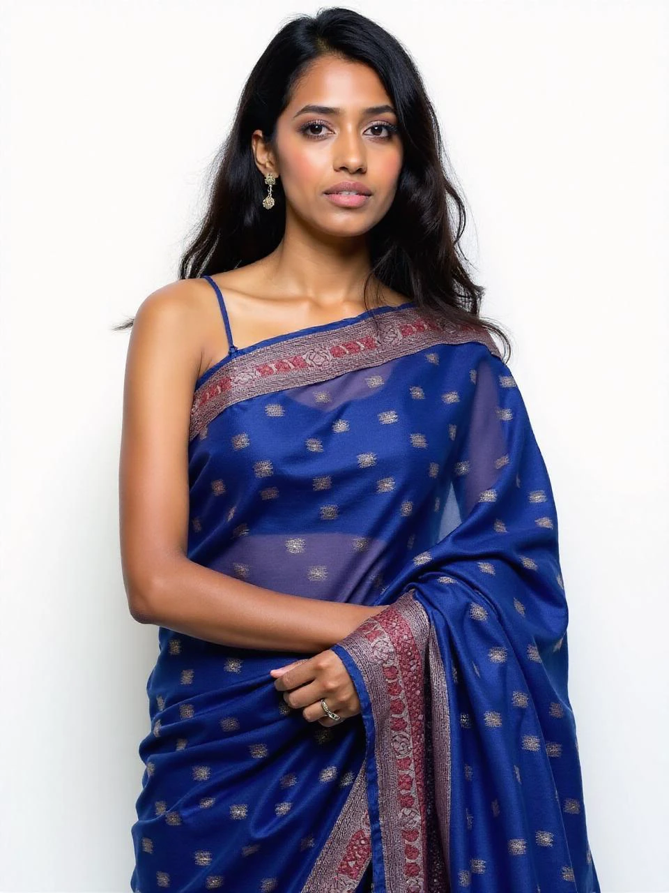 close_up portrait photo of 25 year old beautiful desimocha woman, (plain white background), Blue ethnic print Saree, fashion photography, dynamic pose, facing viewer < <lora:DesiCoffee_Trial_Flux_LoRA_V1:1>âââ