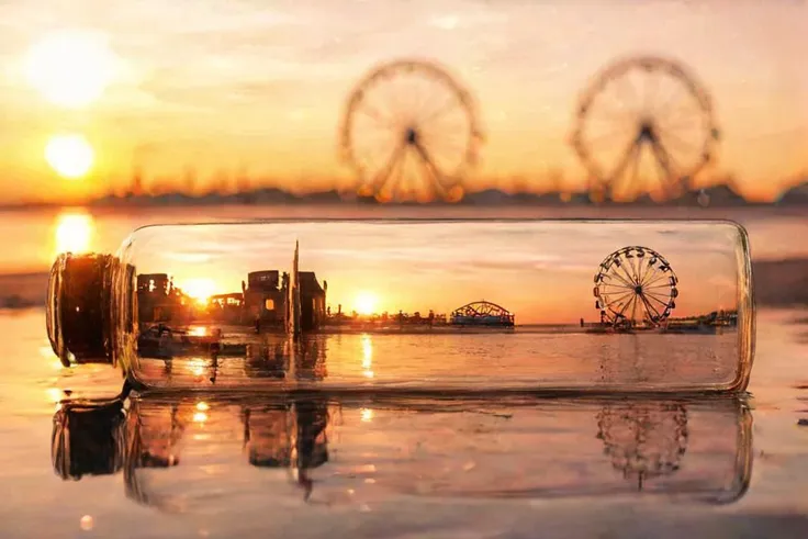 f-b-c, sharp foreground: a bottle on a beach, blurry background: a ferris wheel next to a setting sun, effect: the bottle encapsulate the background, <lora:Foreground-Background_concepts-000003:0.8>