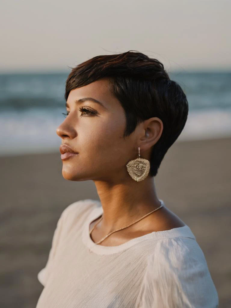 woman, latina, dreaming, (looking away:1.7), dark skin, surprised<lora:A_SHort_Cut_v3_SDXL:1.1>short hair, (pixie cut:1.2), dark eyes, on the beach, white shirt, sunny day,
