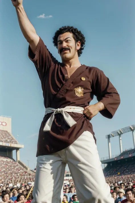 mr satan,1boy, solo,cowboy shot, black hair,blue eyes,(brown dougi,white sash, white pants),arm up,legs apart, standing, stage,stadium,outdoors,looking down,outstretched arm,mustache,muscular male,crowd,(best quality, masterpiece,realistic, photorealistic, film grain, depth of field)  <lora:mrsatan_v1:1>