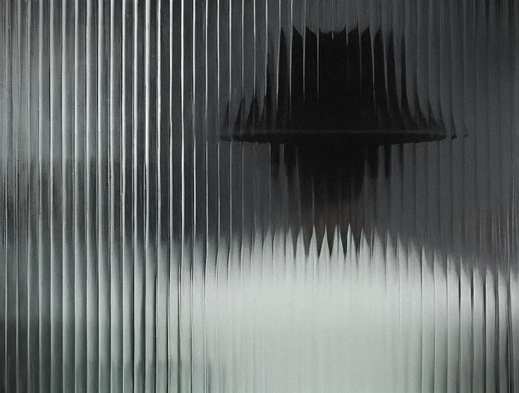 <lora:optical_yiu_v2:1>, ribbed glass, reflection of the (man:1.2) in black jacket behind glass, (fade:1.2), slate grey, (deep depth:1.4), (8k old glass texture:1.2), (raw:1.2)