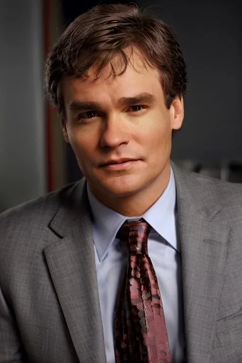 <lora:drjameswilson:0.8> masterpiece, photography, realistic, dr james wilson, gray suit, red tie, portrait