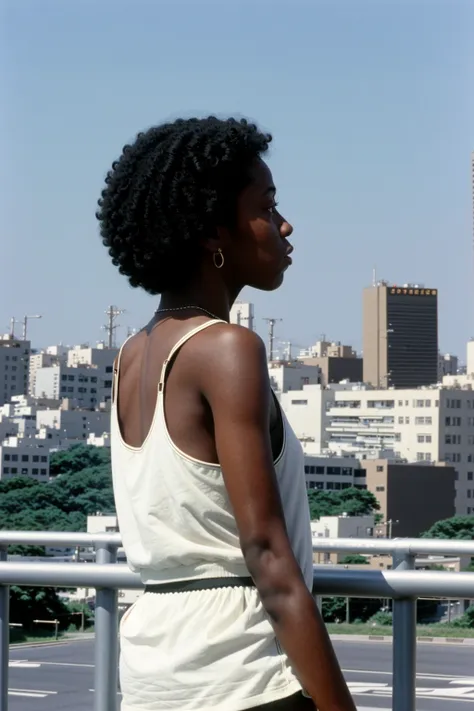 color film photograph of black girl, wearing 80s fashion, short, tanktop, 1980s, Tokyo, city, looking into the distance, modelshoot style, 35mm,provia,dramatic light, flat chest, <lora:80sJapanAnalogFilm_10:0.6>