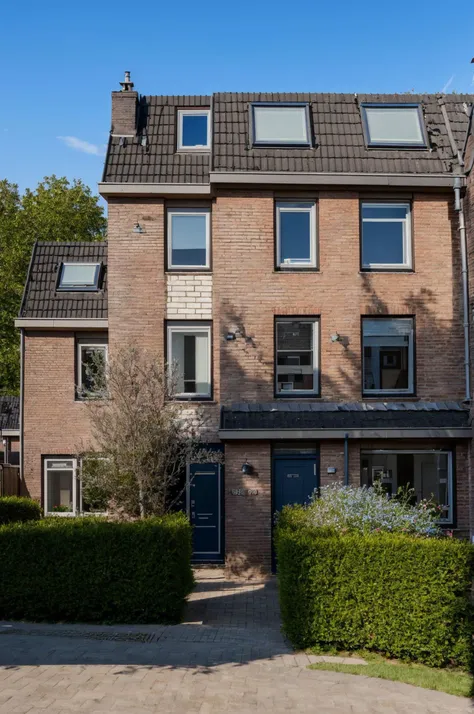 <lora:Grienden_Style_Revisited:0.7>, griendenstyle, a house by itself, red bricks, grey shingles, blue windows, fence, sunny day, evening, masterpiece, dslr photo