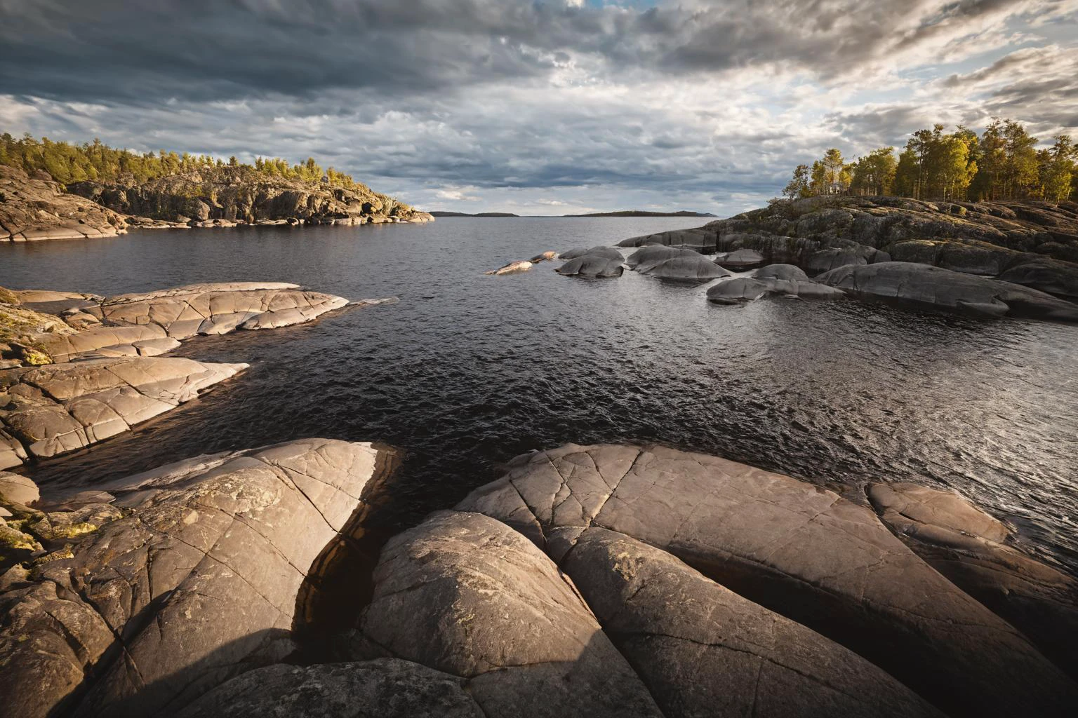 CINEMATIC SHOT, professional photo by Caravaggio of wild nature, lake ladoga, cliffs, rocks, dramatic clouds, summer, rule of thirds, view from surface, (by Christopher Nolan:1.4),F11,(DOF, Cinematic Color grading, intricate, hyper realistic, detailed, flickr, cinematic lighting) <lora:Wild_nature_XL:1>