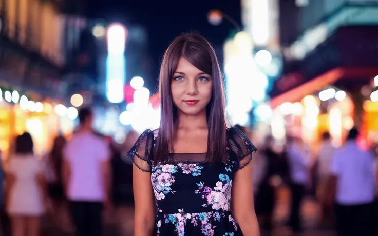 woman looking into the camera, at night, dark, wide angle, crowded street, blurry background, full body, cute, floral dress, excited <lora:FoxyDi:1>