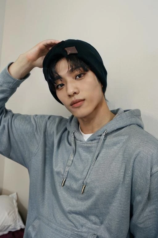 <lora:keehop1:0.65> keehop1 wearing a hoodie, beanie, hand behind head, bedroom, taken on a film camera