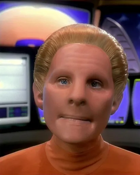 ds9changeling, femalechangeling, female, skin like clay, featureless face, featureless ears, no eyebrows, slicked back blond hair, wearing orange coral color dress, wide shot, front view, facing viewer, computer consoles in background, salome jens, raw photo, posed portrait, <lora:ds9changeling_lora:0.9>