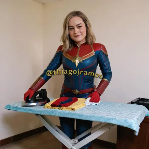 Photo of brieXL wearing a captain marvel outfit, red gloves, smile, detailed face, holding irondo, (ironing clothes:1.4), shirt on ironing board, a pile of clothes nearby, <lora:brieXL:1>, <lora:dryiron:1>