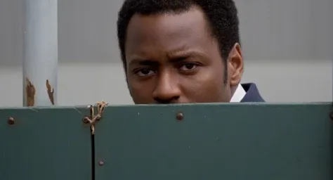 cinematic film still of <lora:Cinematic Vintage Hollywood Film Style:1> sharp detailed, Cinematic Vintage Hollywood Film Style
<lora:Film Stock Footage Style:0.5>
Closeup of a black man partially covered by shadows is looking through a fence with a sad face and perfect over exposed morning sunlight on Kodak Vision3 500T Film Stock Footage Style, shallow depth of field, vignette, highly detailed, high budget, bokeh, cinemascope, moody, epic, gorgeous, film grain, grainy