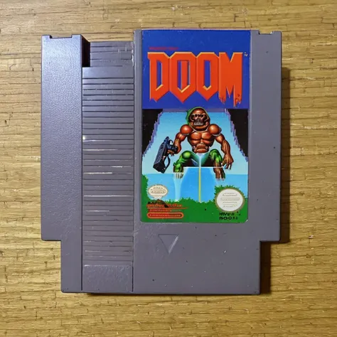 nes videogame cartridge, Doom, english text, no humans, solo, parody <lora:nes:1>
