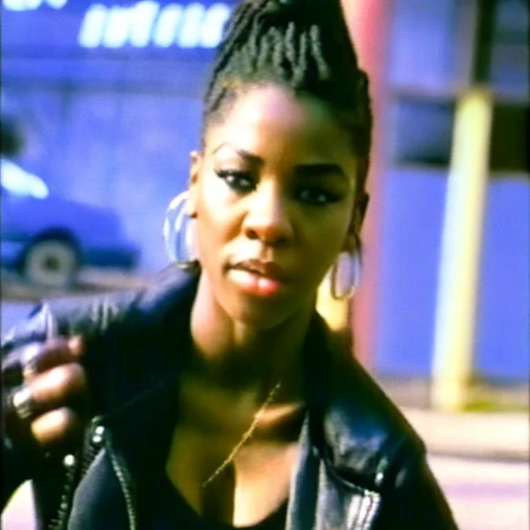 90VHS, vhs still from tv, vhs from documentary, vhs commercial, photo of (RosalineNobodySD15:1.0) black woman fighting stance cyberpunk streets depth of field bokeh bright morning light (masterpiece) (best quality) (detailed) (8k) (HDR) (wallpaper) (cinematic lighting) (sharp focus) (intricate), (masterpiece:1.2) (photorealistic:1.2) (bokeh) (best quality) (detailed skin) (intricate) (8k) (HDR) (cinematic lighting) (sharp focus), perfect face, detailed face, <lora:90VHS-03:1>