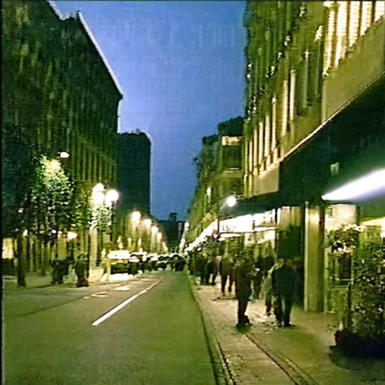 90VHS, vhs still from tv, vhs from documentary, vhs commercial, ((photo of a city street, night time on VHS style image like 80s)), ((high quality:1.2, masterpiece:1.2)),high details, detailed and intricate, intricate details, high intricate details, absurd amount of details,((upper body:1.2)), portrait, Realism, Ambient Occlusion, Natural Lighting,Volumetric Lighting, Volumetric Light, Volumetric, <lora:90VHS-03:1>