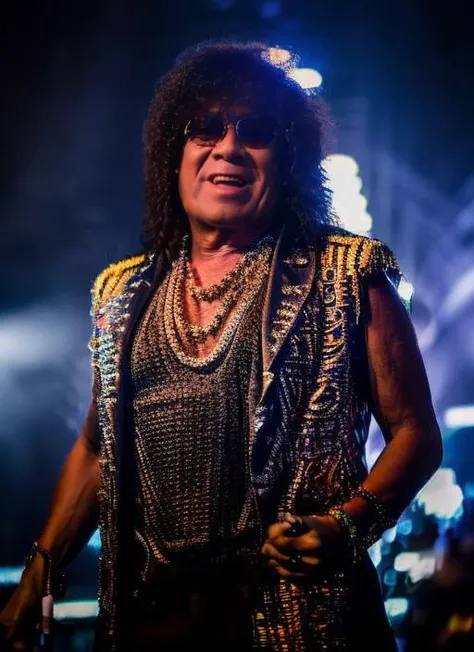 portrait of sks man (monagimenez:1) dressed like a rock star over the stage, neon lights in background, high detailed face, 4k, 8k, cinematic, <lora:monagimenez:1>
