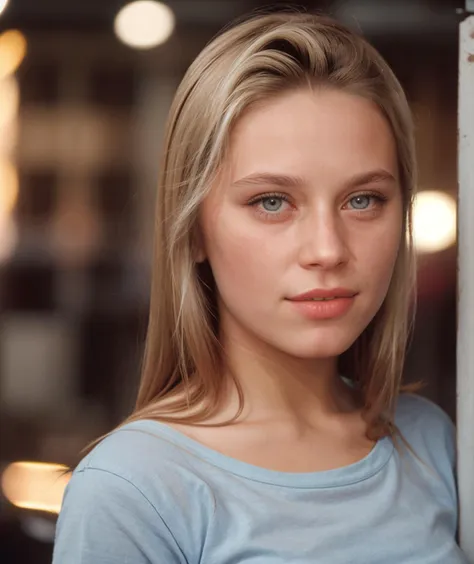 a close up of a woman leaning against a wall with a light on