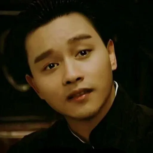 a man with a black shirt and a tie on and a black shirt with a white shirt on and a black shirt with a white shirt on