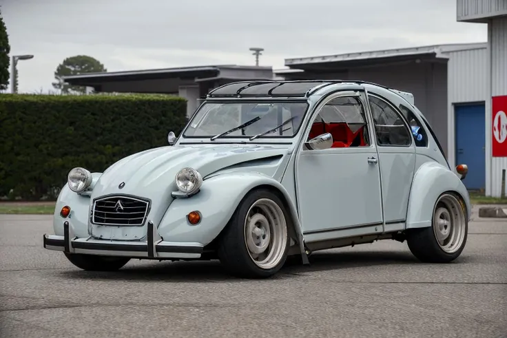 (best quality, masterpiece), photo of a 2cv, <lora:2cv:0.65>, widebody sports car, lowered, large box fenders, deep dish rims, racing wheels, ground vehicle, motor vehicle, <lora:conceptWB_v1:0.85>