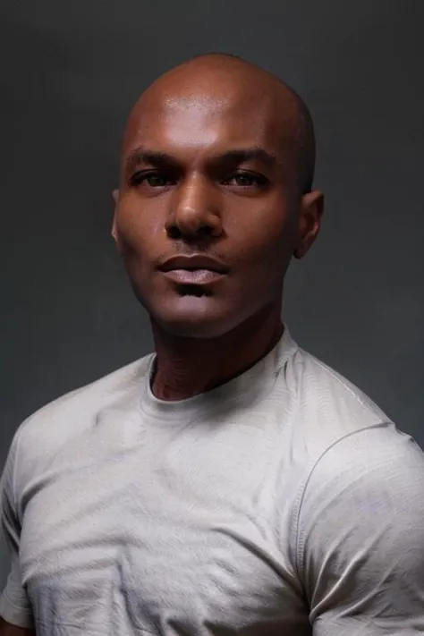 <lora:rhyheimsv3:1> rhyheims, black man, bald, dark skin, brown eyes, professional studio quality modeling headshot, 4K, simple dark background, dramatic lighting, neutral expression, realistic skin, fine detail, shirt, ultra realistic photograph, professional photograph, by Gucci photographer.
