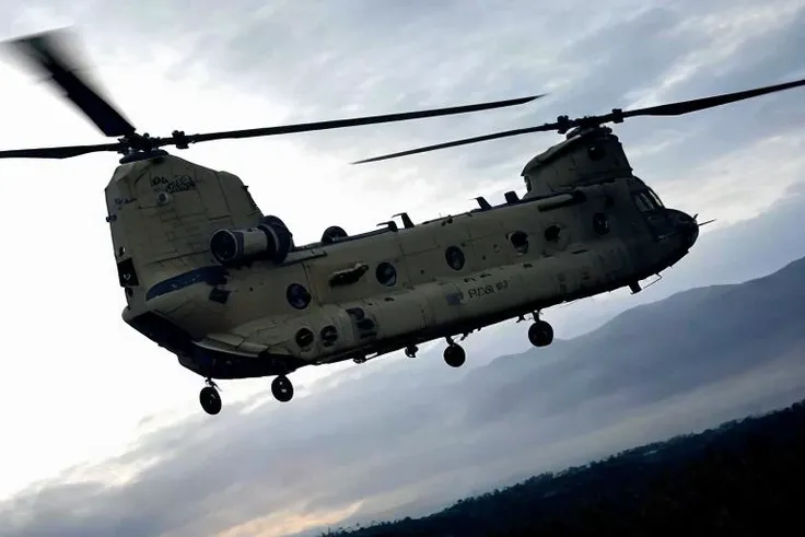 analog gloomy aerial photo of a (Chinook helicopter, <lora:ch1n00k:1>), ((nighttime)), (flying low through a city on fire), (explosions in the background), (tracer gunfire),  High Detail, Sharp focus, (photorealism), realistic, best quality, 8k, award winning, dramatic lighting, epic, cinematic, masterpiece, rim light, (action movie), war,  depth of field, dutch angle, motion blur,