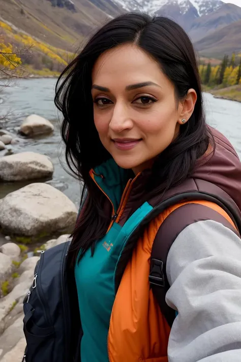((selfie)) photo of arch1ep4njabi, smiling, outdoors, mountains, wearing a backpack, sweater, and hiking jacket, rocks, river, wood, analog style (look at viewer:1.2) (skin texture), close up, cinematic light, sidelighting, Fujiflim XT3, DSLR, 50mm