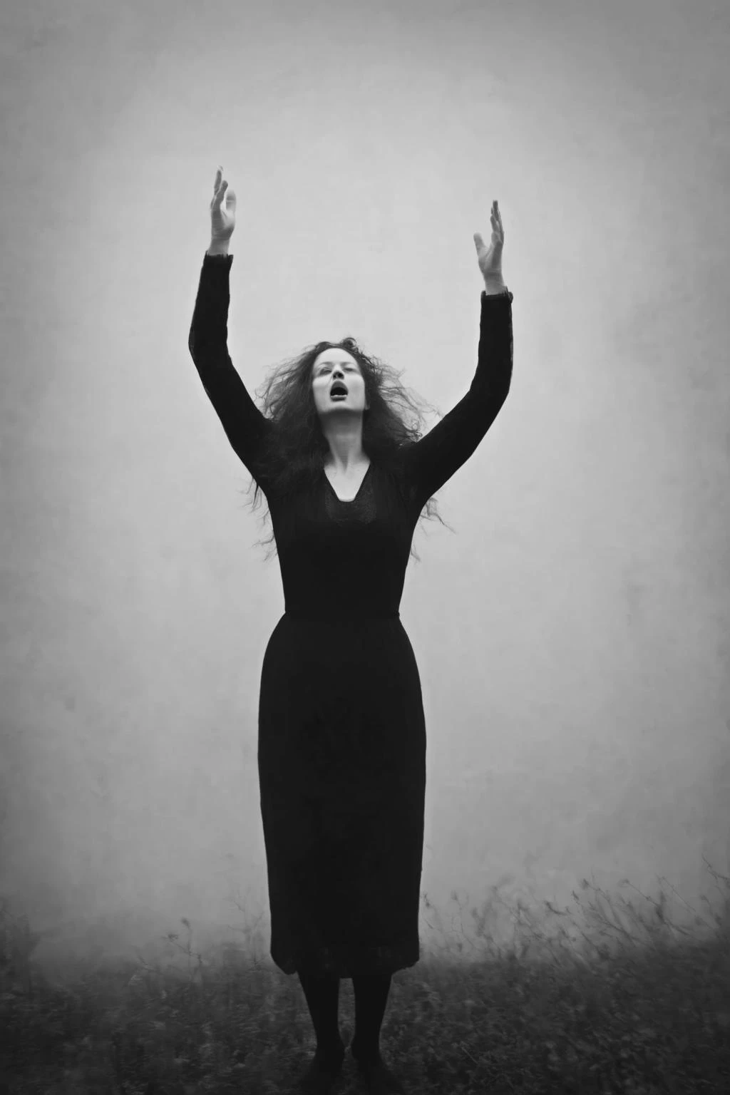 <lora:Photographer Maren Klemp Style:1>Photographer Maren Klemp Style - a black and white photo of a woman with her hands up in the air