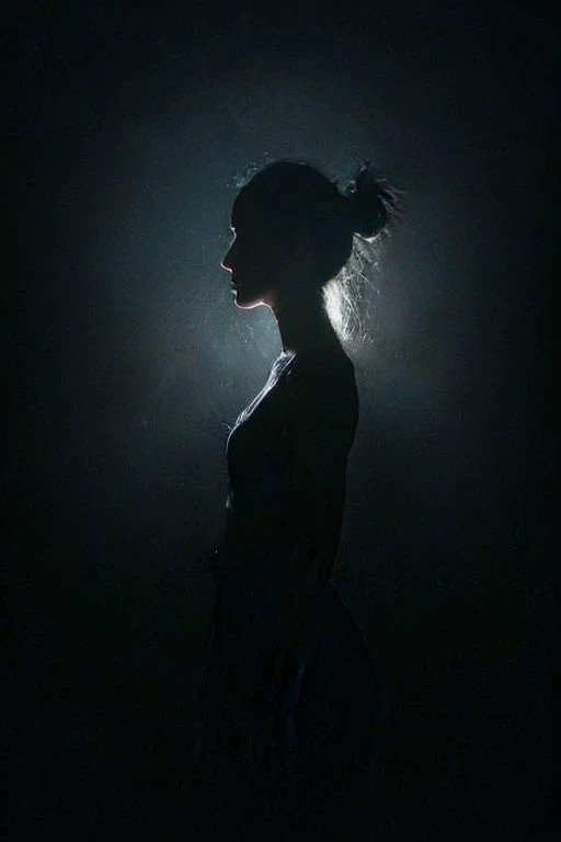 Dive into the depths of the surreal with hyperkraximalism as dark shadows envelop her, pierced only by a piercing rim light that traces the contours of her form. Amidst the darkness, vibrant hues cascade like a waterfall, evoking the fluidity of water and the delicate rustle of leaves. In this medium portrait shot, she stands as a mysterious silhouette against the inky blackness, surrounded by swirling clouds of color that dance in the ethereal glow. Surreal and mesmerizing, this artwork beckons viewers to explore the enigmatic realm where dreams intertwine with reality, illuminated by the flickering light of imagination.