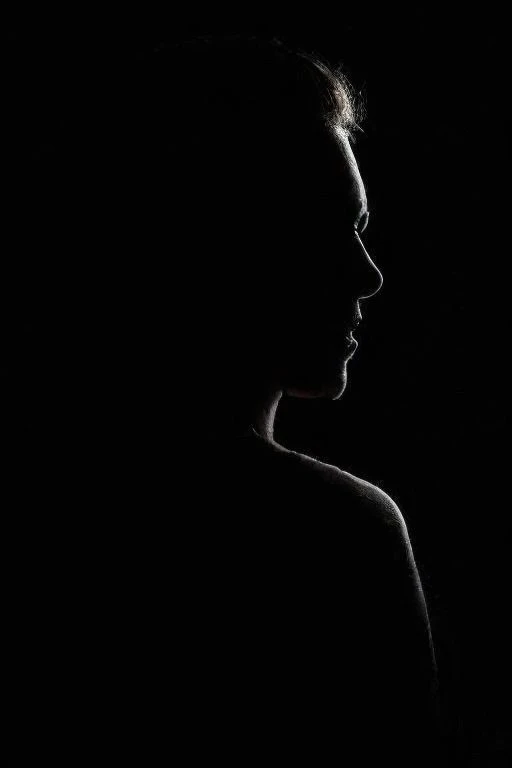 Dive into the depths of the surreal with hyperkraximalism as dark shadows envelop her, pierced only by a piercing rim light that traces the contours of her form. Amidst the darkness, vibrant hues cascade like a waterfall, evoking the fluidity of water and the delicate rustle of leaves. In this medium portrait shot, she stands as a mysterious silhouette against the inky blackness, surrounded by swirling clouds of color that dance in the ethereal glow. Surreal and mesmerizing, this artwork beckons viewers to explore the enigmatic realm where dreams intertwine with reality, illuminated by the flickering light of imagination.