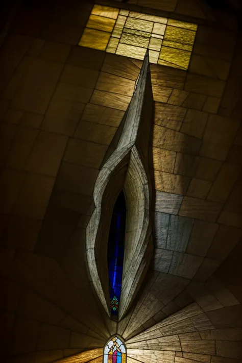 (Stained glass windows:1.2) in a grand cathedral, capturing the intricate details, vivid colors, and the way the sunlight filters through, with a photorealistic shot simulating a Nikon D850 and a 50mm prime lens, emphasizing the radiant beauty and architectural marvel.
