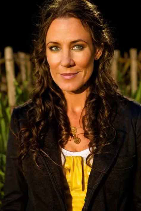 hag costume , corn maze , night <lora:Orla_Brady:1> masterpiece, best quality, detailed face,, 1girl, solo, a mature o1873b, brown_eyes, realistic, brown_hair, long_hair, posing,