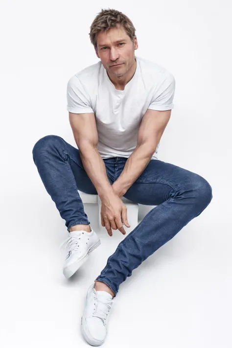 <lora:nicolajcoster:1> nicolajcoster, wearing a shirt and jeans and sneakers, against a white background
