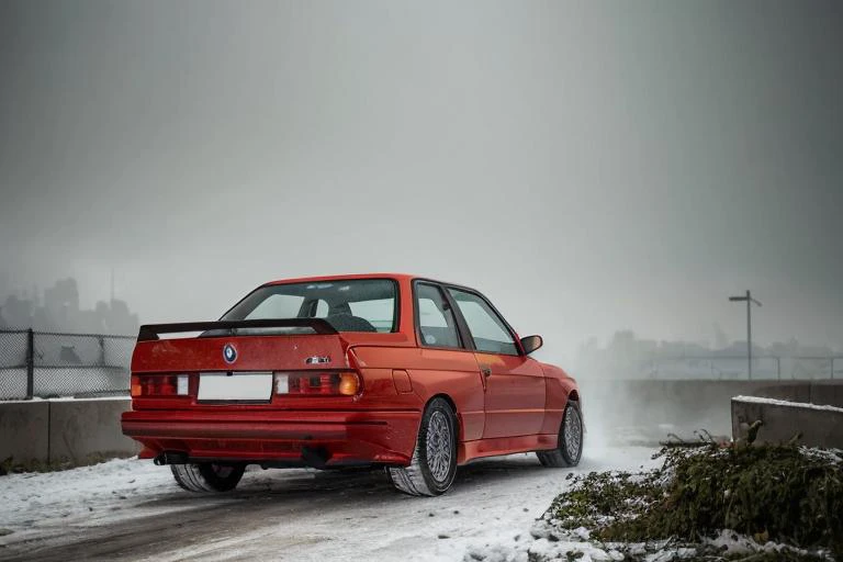 analog gloomy (close up shot) photo of a (red BMW E30 car, <lora:bmwe30:1>), ((speeding in an abandoned city (at midnight))), ((decayed apartment buildings in the background)), ((snow)), (horror movie), ((nighttime)), (midnight), ruins, claustrophobic, High Detail, Sharp focus, ((photorealism)), ((realistic)), best quality, 8k, award winning, dramatic lighting, epic, cinematic, masterpiece, backlit, contrejour, rim light, ambient fog:1.4, dutch angle, depth of field, volumetric lights,