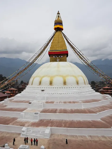 <lora:Boudhanath_Stupa:0.6> boudhanathstupa,build on the top of a mountain, drone photo