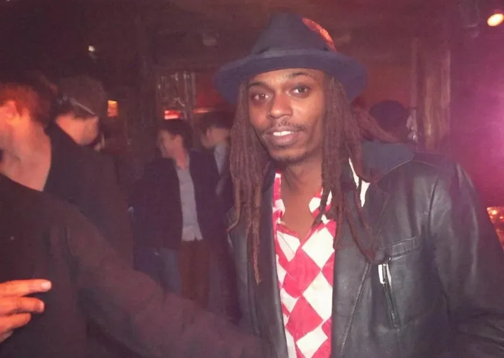 <lora:Young Dave Chappelle SDXL- Trigger is Chappelle Person:1> chappelle Person dressed up like Rick James with dreadlocks, Fancy nightclub in Hollywood. Afterhours. Smooth.