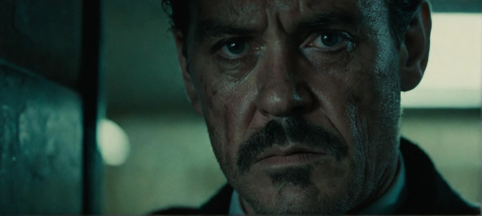 A film still portrait face focused of a hardened detective with a weary expression, gritty, noir, crime thriller, close-up.