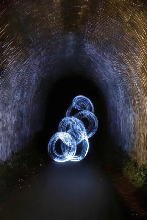 <lora:Photographer Martin Kimbell Style:1>Photographer Martin Kimbell Style - a long exposure photo of a light painting in a dark tunnel with trees in the background