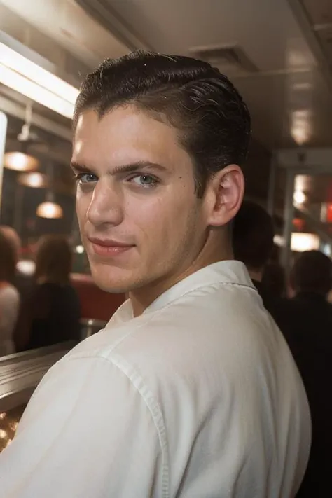 portrait, w3nm1l, handsome man, stunning eyes, upper body, short hair, buzz cut, in a retro diner at night, facial focus, amateur, candid