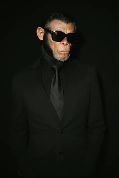 (analog photo) of a chimp wearing a black suit with a white shirt and black necktie and wearing black Rayban style sunglasses, masterpiece, Fine art photography, award winning photography
