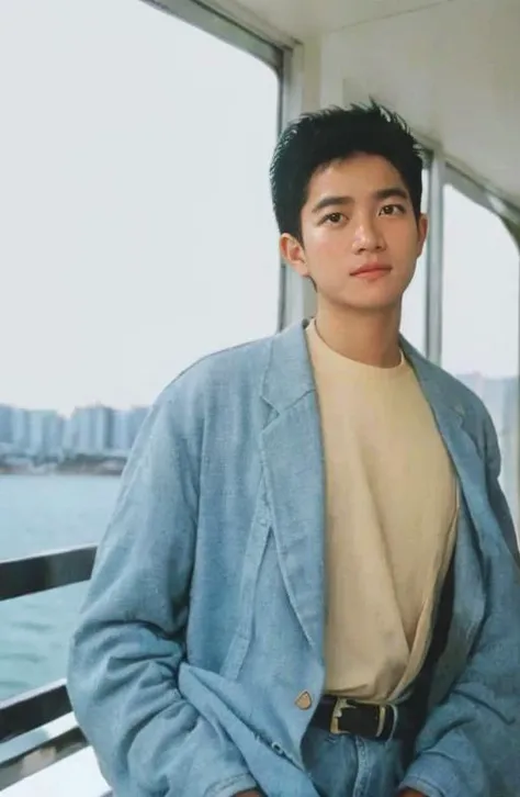 (8K, RAW photo, best quality, masterpiece:1.2), Fujifilm XT3, ultra high res, 8K UHD, HDR, dslr, professional photograph, (realistic, photorealistic:1.4), professional light, 1boy, (dannychan boy), male focus, solo, shirt, yellow shirt, outdoors, ocean, sea, , facial hair, pants, sitting, black hair, denim, day, t-shirt, jeans, beach, looking at viewer, <lora:DannyChan_ICBINP_AfterBurn:.75>