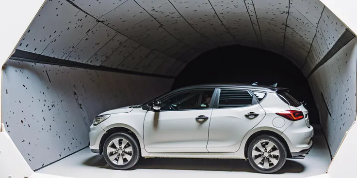 close up of a sugar paper evo car driving in a tunnel, shot on 70 mm, dark white and azure, in the style of wes anderson <lora:evo-car-lora-sd21-768_v02b-000010:0.9>