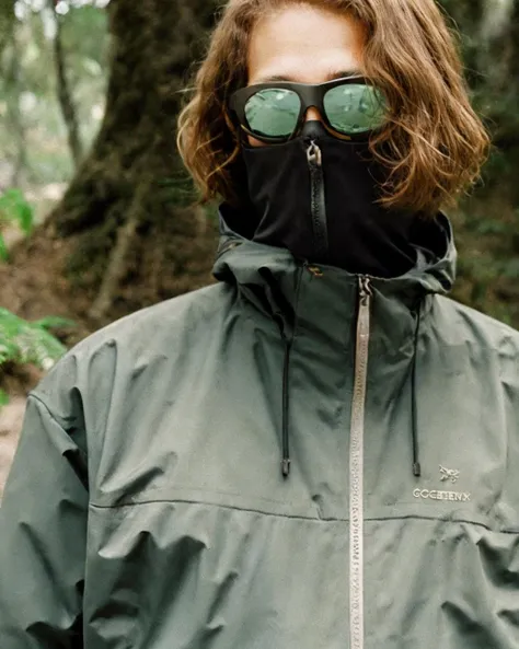 ,black jacket,sunglasses, detailed face, masterpiece,gorpcore,80mm f/11 on kodak ektachrome e100, soft focus, film grain, muted colors,swamp,jungle,,psychedelic, <lora:gorpcoreLORA:1>