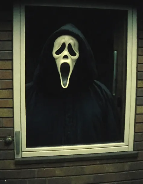 a cctv blurry image,high-angle,taken from a monitor,showing Ghostface from a doorbell view outside a house,vhs filter,(low resolution:1.3),grainy,eerie,horror,dark